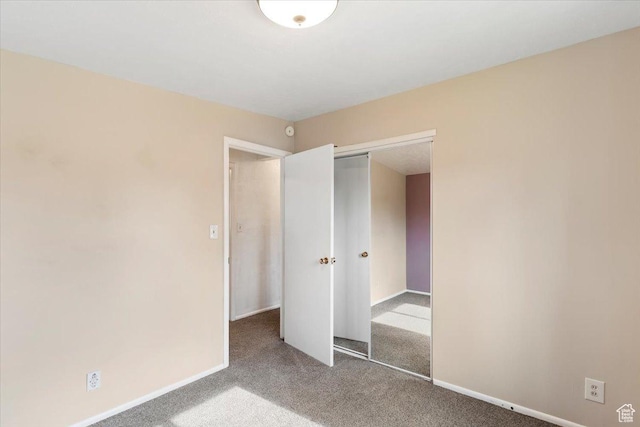 5680 S 2600 W Unit 12, Roy, UT 84067 - unfurnished bedroom featuring carpet flooring, a closet, and baseboards