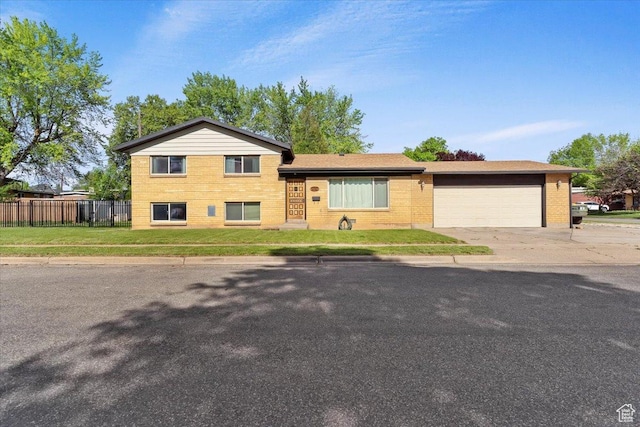 5680 S 2600 W Unit 12, Roy, UT 84067 - split level home featuring driveway, an attached garage, and brick siding