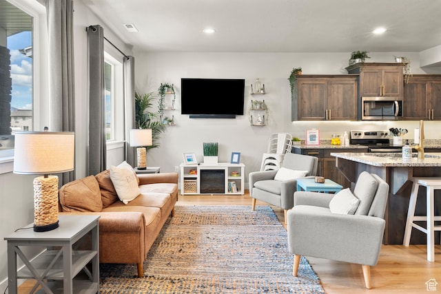 150 W Seasons Loop Unit 3, Garden City, UT 84028 - living area featuring light wood-style floors and recessed lighting