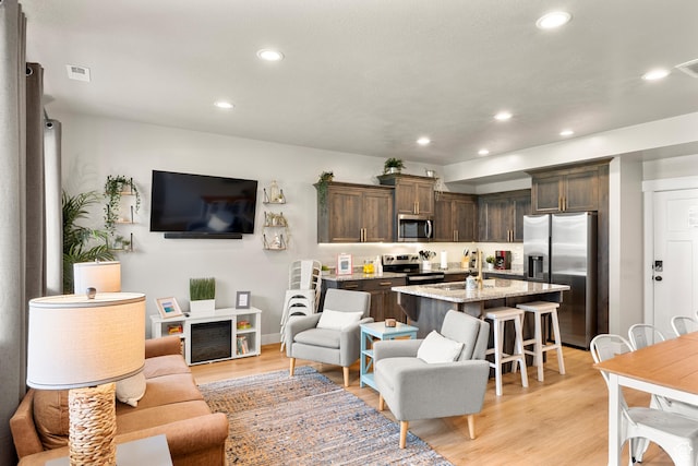 150 W Seasons Loop Unit 3, Garden City, UT 84028 - living area featuring recessed lighting, light wood finished floors, and baseboards
