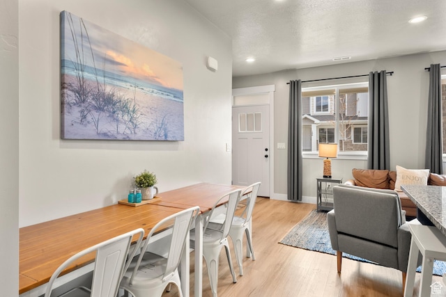 150 W Seasons Loop Unit 3, Garden City, UT 84028 - dining room with light wood-style flooring, recessed lighting, and baseboards