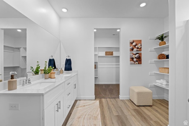 3719 E Padre Cv Unit 4092, Washington, UT 84780 - bathroom with wood finished floors, a spacious closet, double vanity, and recessed lighting