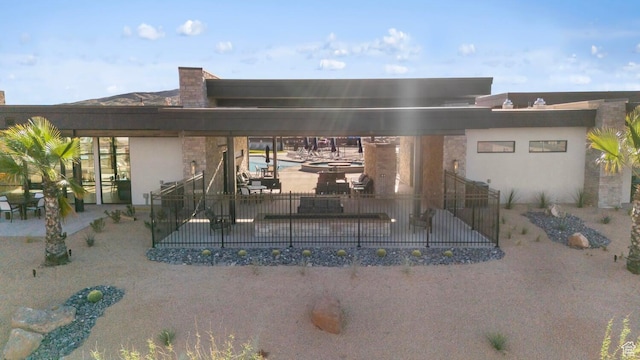 3719 E Padre Cv Unit 4092, Washington, UT 84780 - back of house featuring a patio and stucco siding