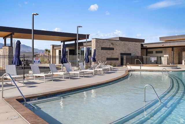 3719 E Padre Cv Unit 4092, Washington, UT 84780 - community pool featuring a patio area and a mountain view