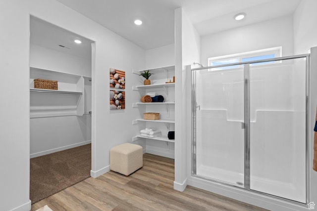 3719 E Padre Cv Unit 4092, Washington, UT 84780 - full bathroom featuring a shower stall, a spacious closet, wood finished floors, recessed lighting, and baseboards