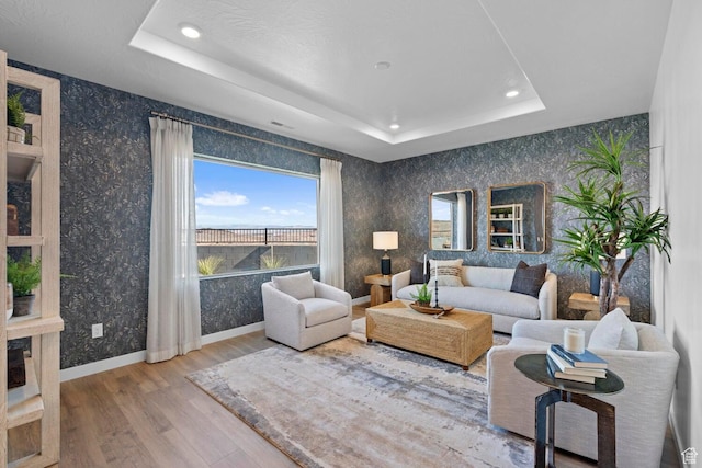 3719 E Padre Cv Unit 4092, Washington, UT 84780 - living room with a tray ceiling, wood finished floors, recessed lighting, wallpapered walls, and baseboards