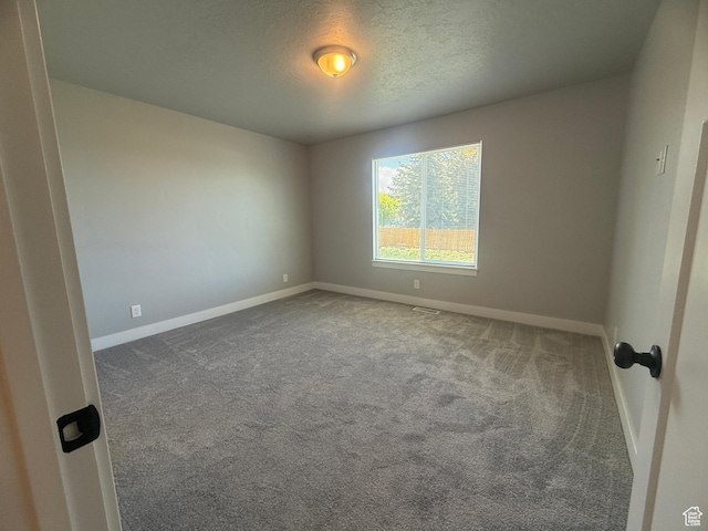 268 S 400 W, Tooele, UT 84074 - carpeted spare room with baseboards and a textured ceiling
