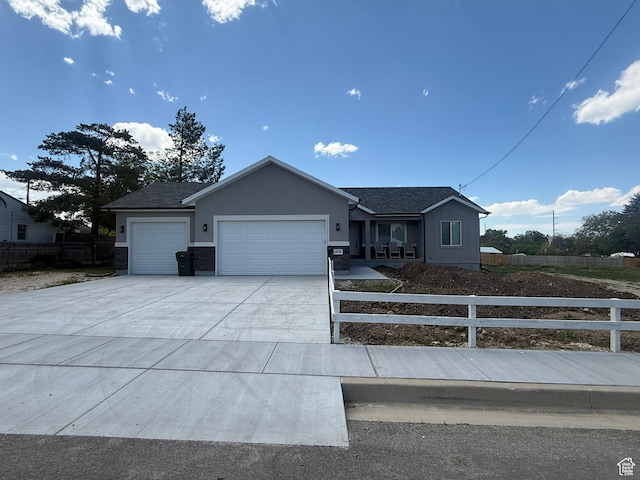 268 S 400 W, Tooele, UT 84074 - ranch-style house with an attached garage, concrete driveway, and roof with shingles