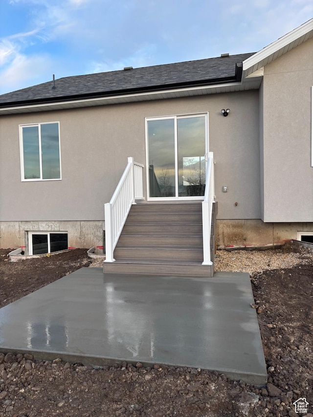 268 S 400 W, Tooele, UT 84074 - view of exterior entry featuring stucco siding, a patio area, and roof with shingles
