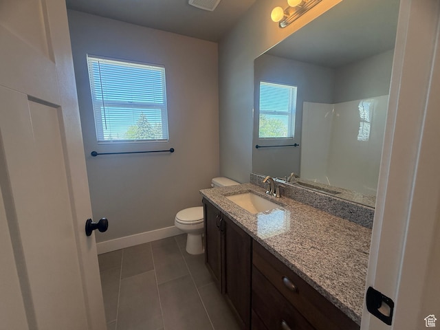 268 S 400 W, Tooele, UT 84074 - bathroom with toilet, tile patterned flooring, vanity, a shower, and baseboards