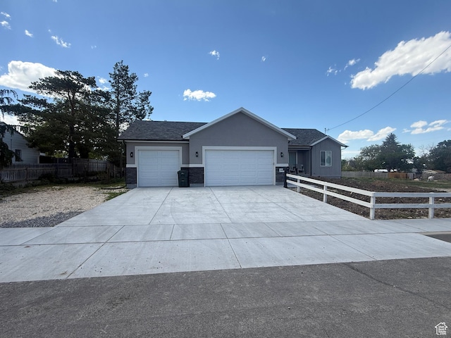 268 S 400 W, Tooele, UT 84074 - single story home featuring a garage, concrete driveway, and stucco siding