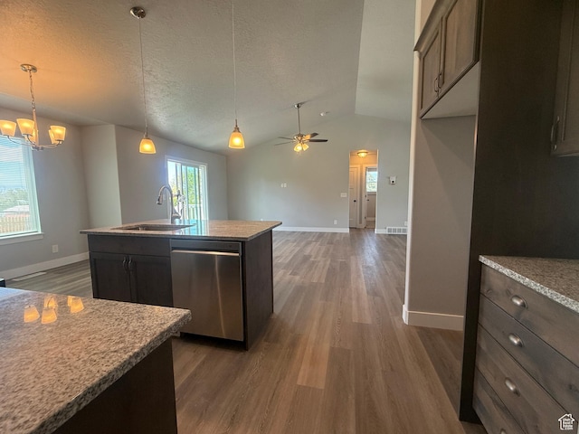 268 S 400 W, Tooele, UT 84074 - kitchen featuring dishwasher, a sink, dark wood-type flooring, vaulted ceiling, and baseboards