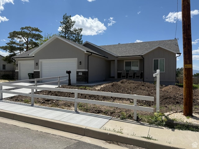268 S 400 W, Tooele, UT 84074 - ranch-style home with a garage, board and batten siding, driveway, and roof with shingles