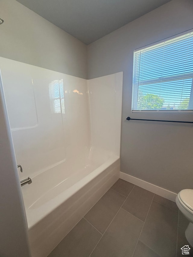 268 S 400 W, Tooele, UT 84074 - bathroom with toilet, baseboards, tile patterned flooring, and shower / bathtub combination