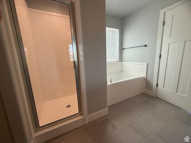 268 S 400 W, Tooele, UT 84074 - full bath featuring a bath, a stall shower, tile patterned floors, and baseboards