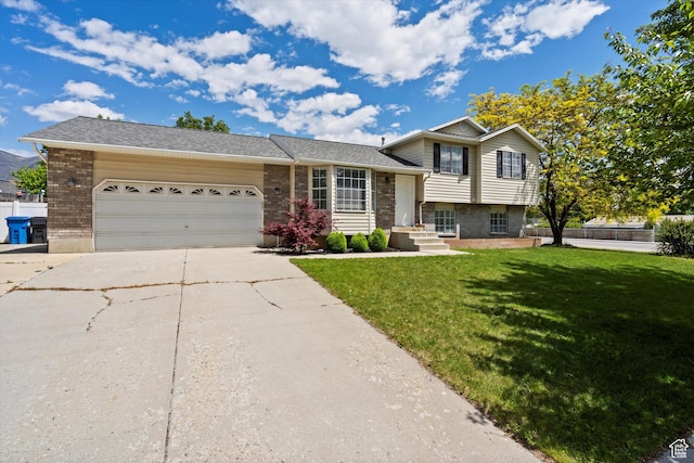 714 N 300 W, American Fork, UT 84003 - tri-level home with brick siding, driveway, a garage, and a front lawn