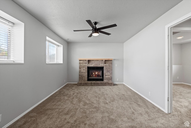 714 N 300 W, American Fork, UT 84003 - unfurnished living room featuring carpet floors, a ceiling fan, a fireplace, a textured ceiling, and baseboards
