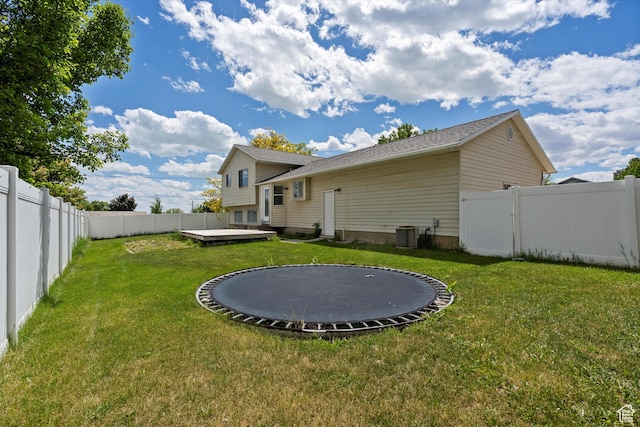714 N 300 W, American Fork, UT 84003 - rear view of house with a trampoline, a wooden deck, and central AC unit