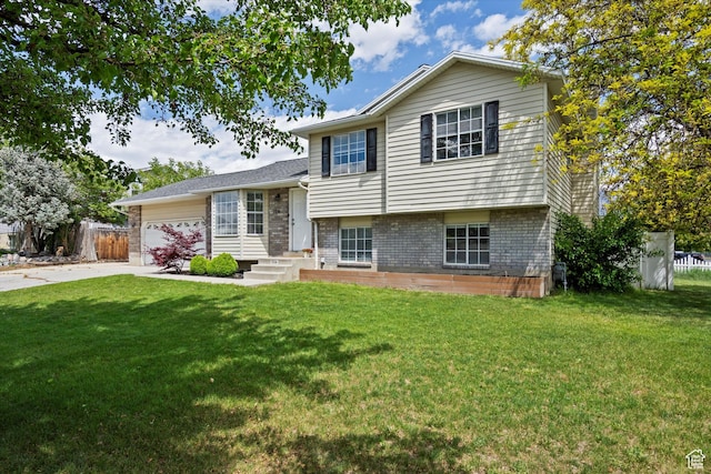 714 N 300 W, American Fork, UT 84003 - tri-level home with brick siding, an attached garage, and concrete driveway