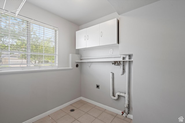 714 N 300 W, American Fork, UT 84003 - laundry room featuring cabinet space, electric dryer hookup, light tile patterned flooring, and baseboards