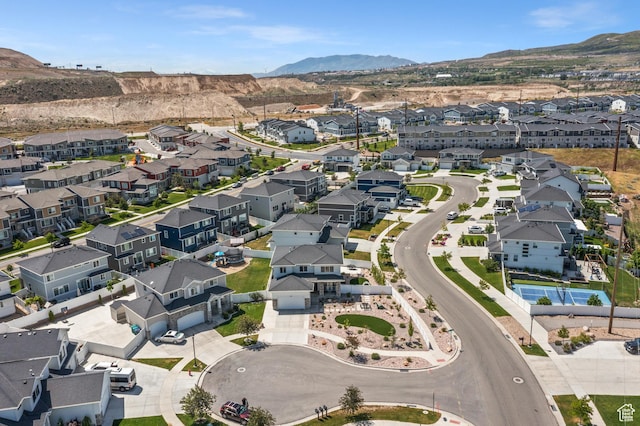 1067 W Ludington Ct, Bluffdale, UT 84065 - aerial view of property and surrounding area featuring a mountainous background and nearby suburban area