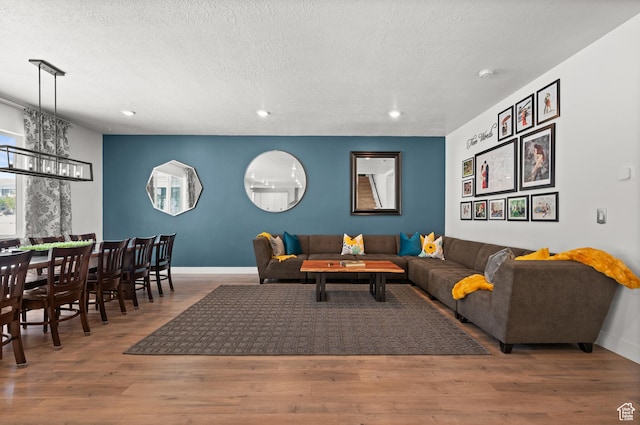 1067 W Ludington Ct, Bluffdale, UT 84065 - living area featuring recessed lighting, a chandelier, wood finished floors, baseboards, and a textured ceiling