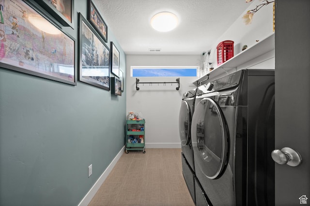 1067 W Ludington Ct, Bluffdale, UT 84065 - washroom with washer and clothes dryer, a textured ceiling, light carpet, and baseboards