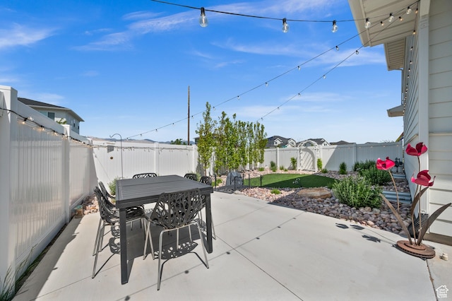 1067 W Ludington Ct, Bluffdale, UT 84065 - fenced backyard featuring a patio and outdoor dining area