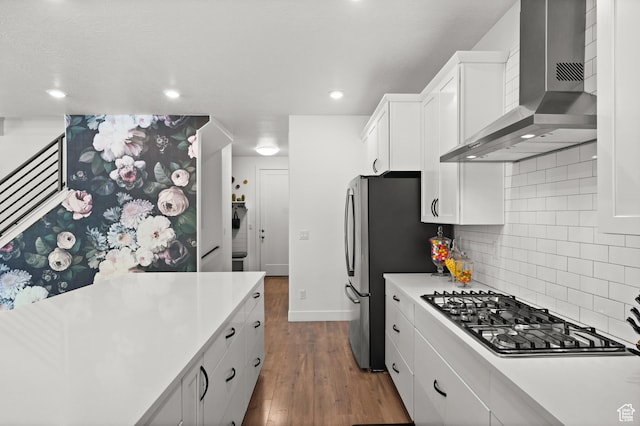 1067 W Ludington Ct, Bluffdale, UT 84065 - kitchen with wall chimney range hood, stainless steel appliances, dark wood-type flooring, light countertops, and decorative backsplash