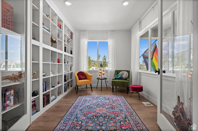 1067 W Ludington Ct, Bluffdale, UT 84065 - living area featuring wood finished floors, french doors, baseboards, and recessed lighting