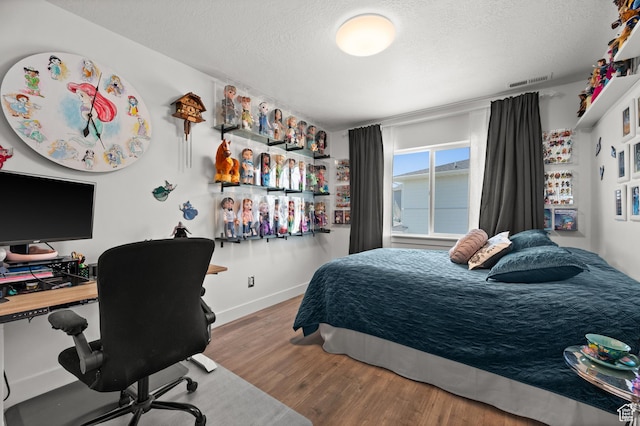 1067 W Ludington Ct, Bluffdale, UT 84065 - bedroom featuring wood finished floors, a textured ceiling, a desk, and baseboards