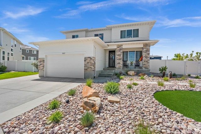 1067 W Ludington Ct, Bluffdale, UT 84065 - view of front of property with concrete driveway, stone siding, an attached garage, and a porch