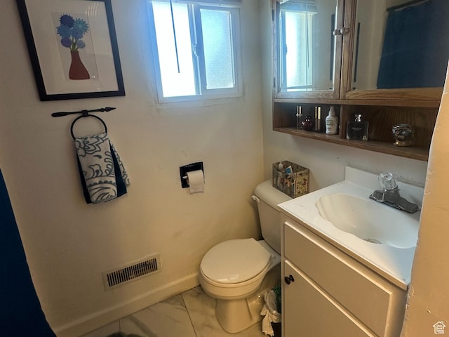110 S 200 E, Cleveland, UT 84518 - bathroom featuring toilet, marble finish floors, vanity, and baseboards