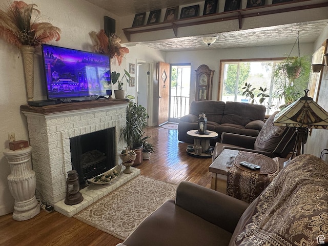 110 S 200 E, Cleveland, UT 84518 - living room with wood finished floors and a fireplace
