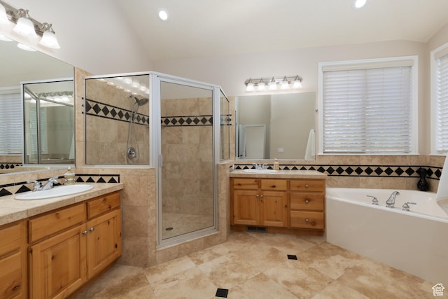 14825 S Meadow Oak Ct, Draper, UT 84020 - bathroom with a stall shower, a bath, two vanities, lofted ceiling, and recessed lighting