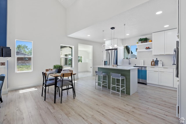 905 N 100 E, Pleasant Grove, UT 84062 - kitchen with stainless steel appliances, a center island, open shelves, healthy amount of natural light, and recessed lighting