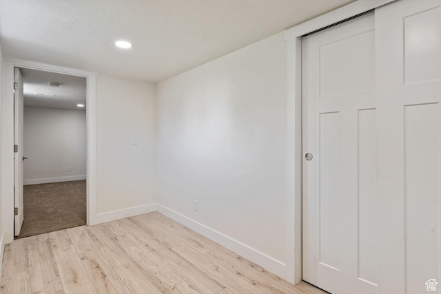 905 N 100 E, Pleasant Grove, UT 84062 - unfurnished room with light wood-style flooring, baseboards, recessed lighting, and a textured ceiling