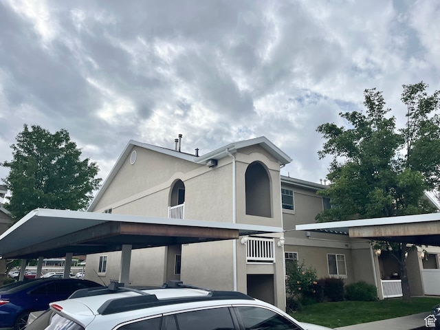 3996 S 855 E # B E, Millcreek, UT 84107 - view of front of house with stucco siding and covered parking