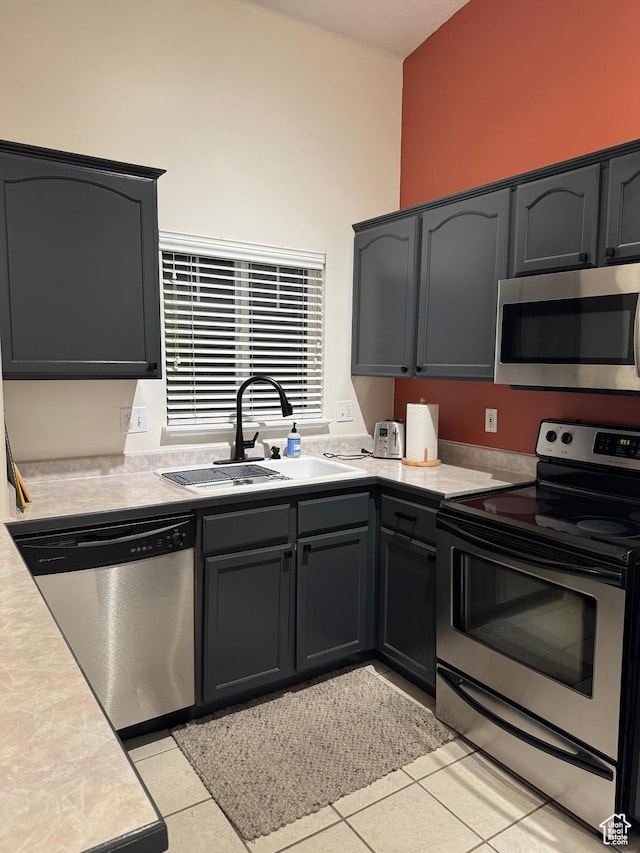 3996 S 855 E # B E, Millcreek, UT 84107 - kitchen with appliances with stainless steel finishes, a sink, light countertops, and light tile patterned floors