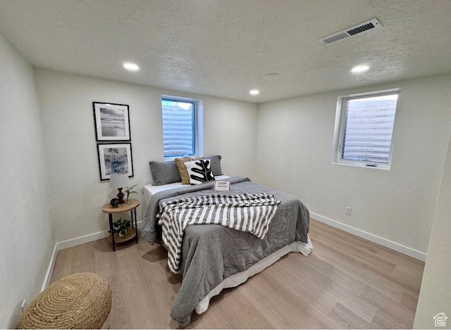 5011 S Leisure Ln W, Taylorsville, UT 84129 - bedroom featuring wood finished floors, baseboards, recessed lighting, and a textured ceiling