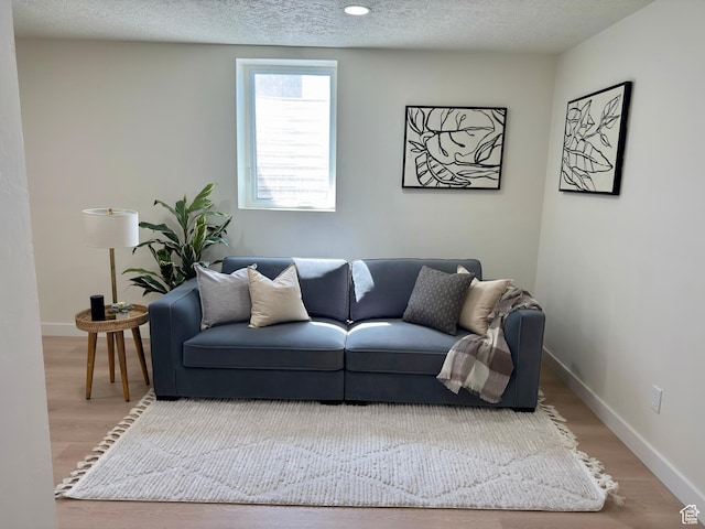 5011 S Leisure Ln W, Taylorsville, UT 84129 - living room with wood finished floors, a textured ceiling, and baseboards
