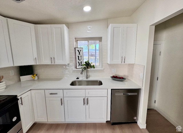 5011 S Leisure Ln W, Taylorsville, UT 84129 - kitchen featuring appliances with stainless steel finishes, a sink, white cabinets, and decorative backsplash