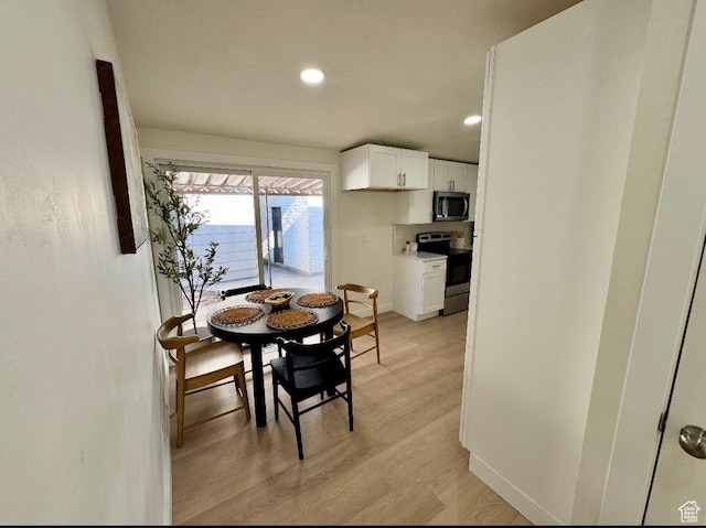 5011 S Leisure Ln W, Taylorsville, UT 84129 - dining area with recessed lighting, light wood-style flooring, and baseboards