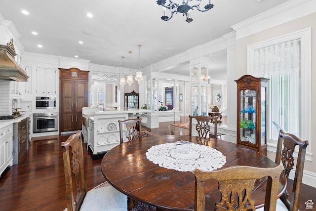 3291 E 1300 N, Layton, UT 84040 - dining room with dark wood-style floors, ornamental molding, recessed lighting, a chandelier, and a decorative wall