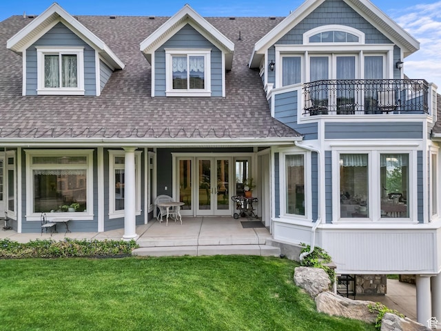 3291 E 1300 N, Layton, UT 84040 - back of house with french doors, a shingled roof, a balcony, and a yard