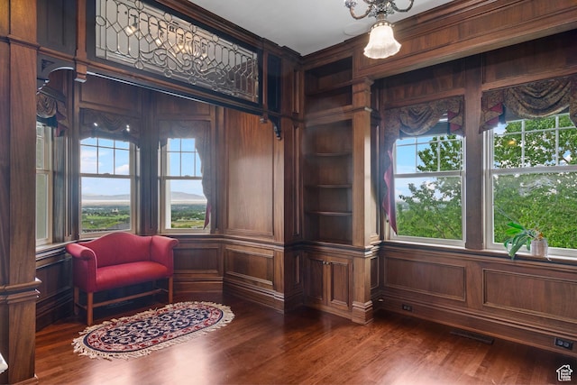 3291 E 1300 N, Layton, UT 84040 - sitting room featuring healthy amount of natural light, dark wood-style flooring, and wood walls