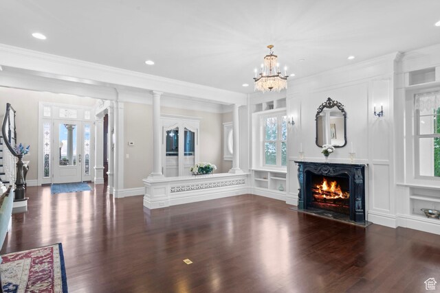 3291 E 1300 N, Layton, UT 84040 - unfurnished living room featuring wood finished floors, crown molding, a warm lit fireplace, recessed lighting, and a chandelier