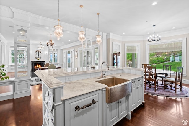 3291 E 1300 N, Layton, UT 84040 - kitchen with a sink, a chandelier, a lit fireplace, dark wood finished floors, and recessed lighting