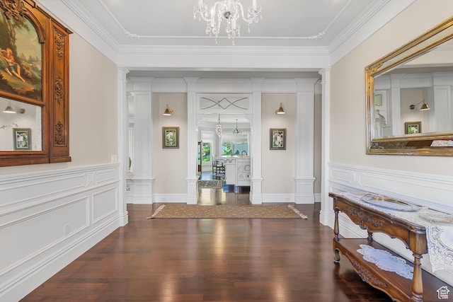 3291 E 1300 N, Layton, UT 84040 - entrance foyer featuring decorative columns, dark wood finished floors, crown molding, a decorative wall, and a wainscoted wall
