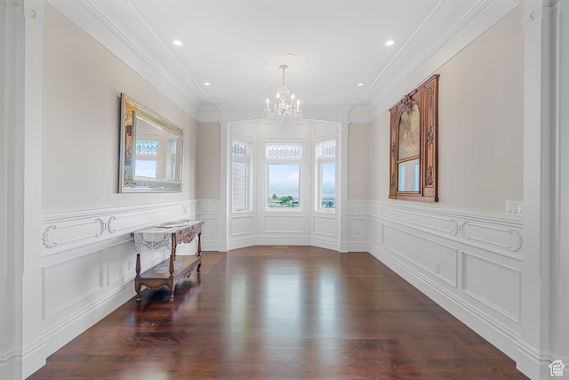 3291 E 1300 N, Layton, UT 84040 - unfurnished dining area featuring a chandelier, a decorative wall, a wainscoted wall, crown molding, and dark wood-type flooring